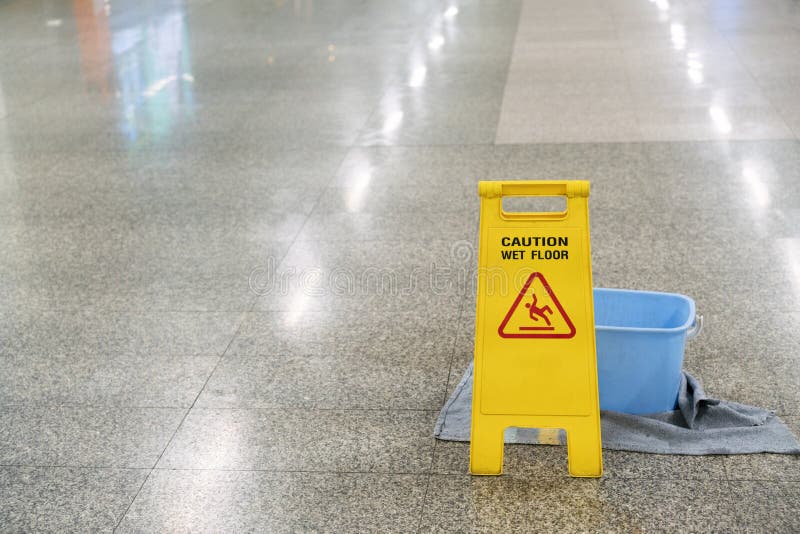 Cleaning progress caution or warning wet floor sign in office