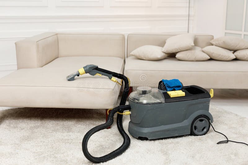 Cleaning Service Vacuum Cleaner with a Sofa Stock Image Image of