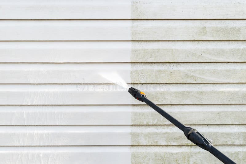 Cleaning service washing building facade with pressure water. Cleaning dirty wall with high pressure water jet. Power washing the