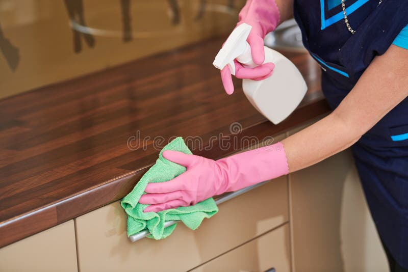 كيفية تنظيف المنازل بشكل احترافي وتوفير خدمات تنظيف المنازل للعملاء. Cleaning-service-wiping-kitchen-cabinet-cloth-liquid-cleaning-service-wiping-kitchen-cabinet-surface-cloth-171111849