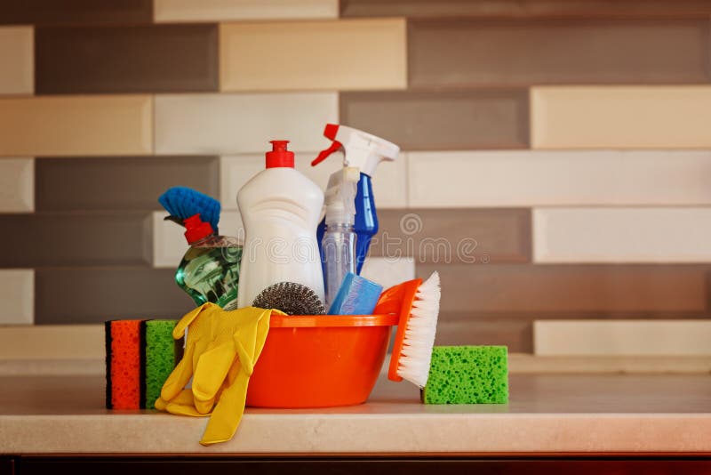 Cleaning set with products and supplies on kitchen table stock photography Cleaning set with products and supplies on kitchen table stock photography