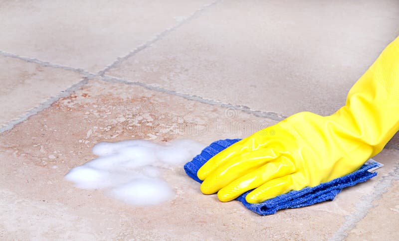 Cleaning tile with cloth stock photo Cleaning tile with cloth stock photo
