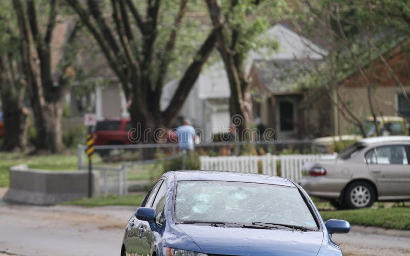 Cleanup after hail storm stock photography