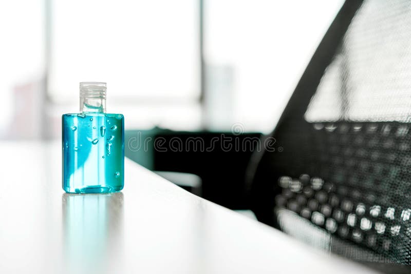 Clear alcohol gel in small bottle for use in hand washing placed on the office table, prevent germs protect virus Covid-19. royalty free stock image Clear alcohol gel in small bottle for use in hand washing placed on the office table, prevent germs protect virus Covid-19. royalty free stock image