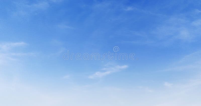 Clear blue sky with a few clouds royalty free stock photography