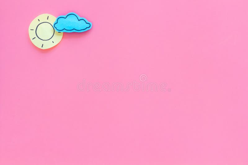 Clear and cloudly weather icons on pink background top view copy space royalty free stock photography Clear and cloudly weather icons on pink background top view copy space royalty free stock photography