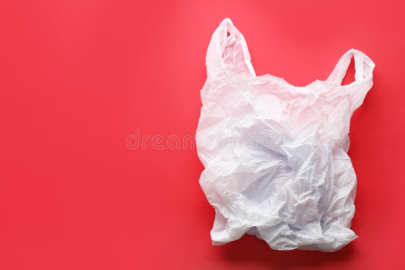 Clear Disposable Plastic Bag On Color Background. Stock