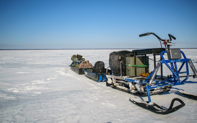 Winter Fishing on a Snowmobile at the Rybinsk Reservoir of the