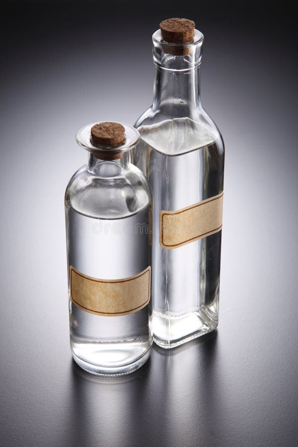 Clear liquid stock image. Image of alcohol, gray, condiment 84482351