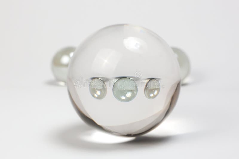 Clear Marbles through Crystal Ball Stock Photo Image of sphere, teller 75479402