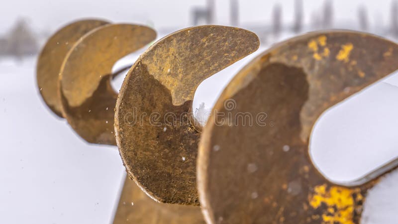 Clear Panorama Teeth of an excavator bucket against a snowy landscape in Daybreak Utah stock photos Clear Panorama Teeth of an excavator bucket against a snowy landscape in Daybreak Utah stock photos