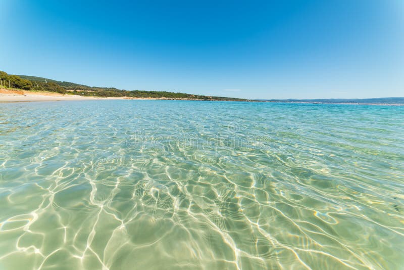 Clear Water in Lazzaretto Beach Stock Photo - Image of rocky, sardinia ...