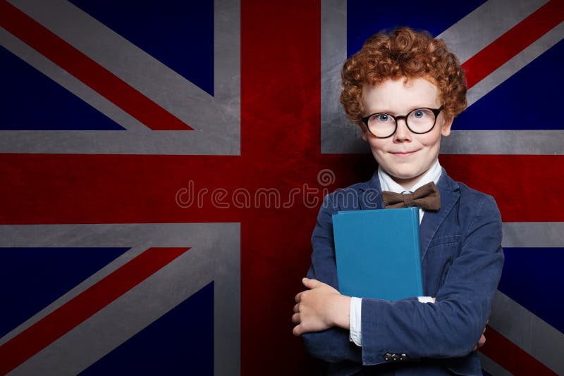 Clever child with book on the UK flag background royalty free stock photography Clever child with book on the UK flag background royalty free stock photography