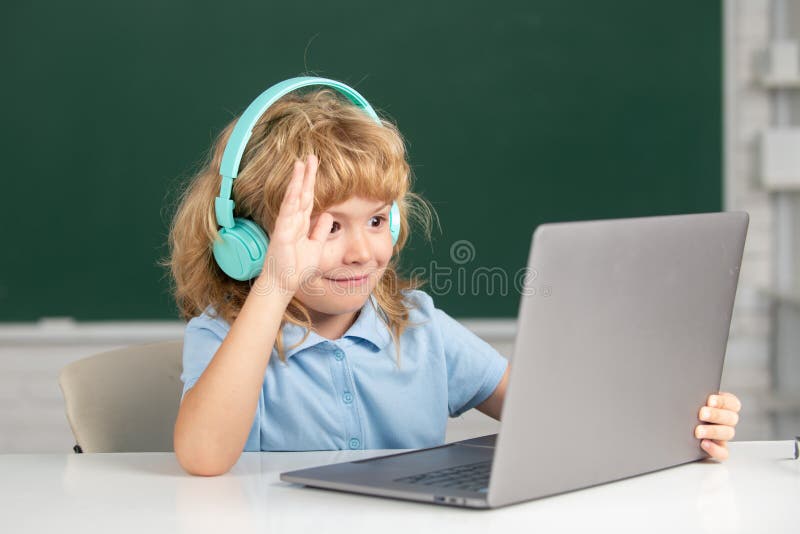 Clever School Boy, Cute Pupil Wears Headphones Writing on Laptop ...