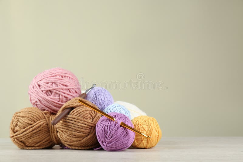 Close-up Knitting From Beige Yarn, Needle, Crochet Hooks. Work On A New  Product. Selective Soft Focus. Free Space For Text. Stock Photo, Picture  and Royalty Free Image. Image 120656233.