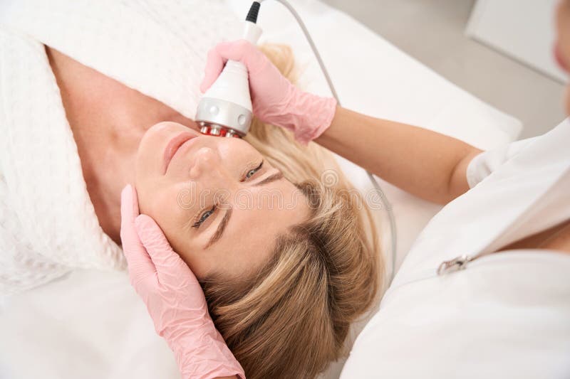 Client Undergoing a Rejuvenating Procedure of Radio Wave Face Lifting