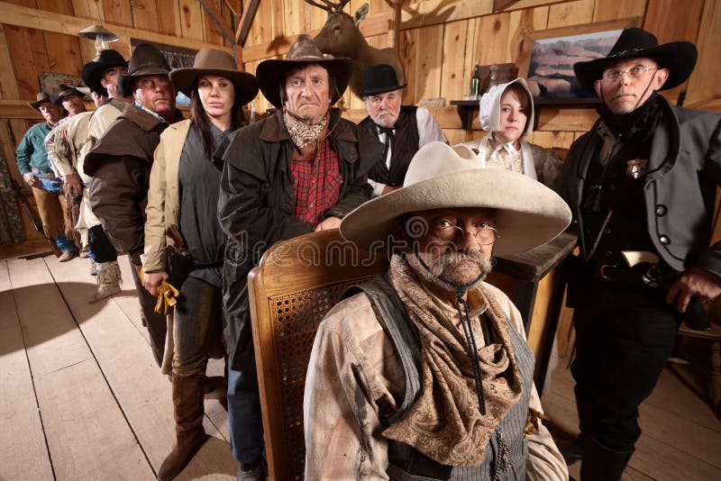 Serious customers in classic old American west saloon. Serious customers in classic old American west saloon