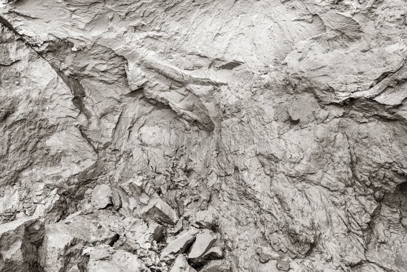 Cliff erosion. Mud, natural clay, cracks in rock background. stock photos