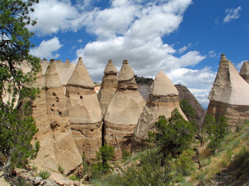 Kashe-Katuwe Tent Rocks National Monument located approximately 40 miles southwest of Santa Fe, New Mexico, near Cochiti Pueblo. Kash-Katuwe means `white cliffs` in the Pueblo language Keresan. Kashe-Katuwe Tent Rocks National Monument located approximately 40 miles southwest of Santa Fe, New Mexico, near Cochiti Pueblo. Kash-Katuwe means `white cliffs` in the Pueblo language Keresan.