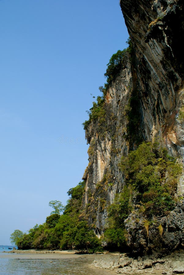 Colorful and high cliff and sea at Railay beach in Thailand. Colorful and high cliff and sea at Railay beach in Thailand