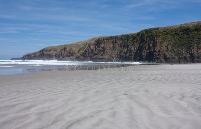 A cliff at the Sandfly Bay Beach in the Otago Peninsula in New Zealand. A cliff at the Sandfly Bay Beach in the Otago Peninsula in New Zealand