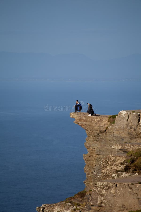 People taking a dangerous selfie, Cliffs of Moher, Ireland, UK stock image People taking a dangerous selfie, Cliffs of Moher, Ireland, UK stock image
