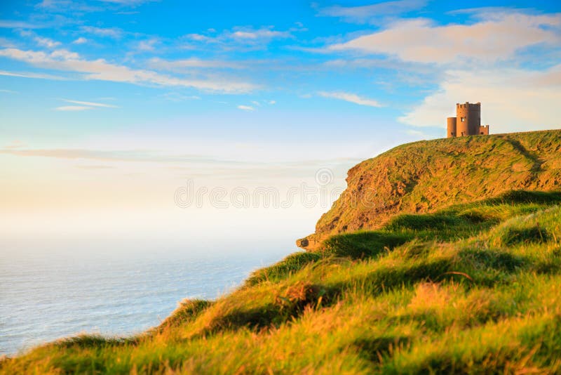 Cliffs of Moher at sunset - O Briens Tower in Co. Clare Ireland Europe.