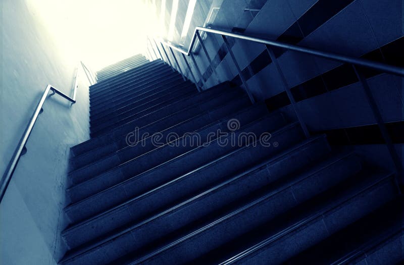 Going towards the light. A concept photograph showing a flight of steps leading from the darkness into the bright light. Positive conceptual image for walking stock photo Going towards the light. A concept photograph showing a flight of steps leading from the darkness into the bright light. Positive conceptual image for walking stock photo