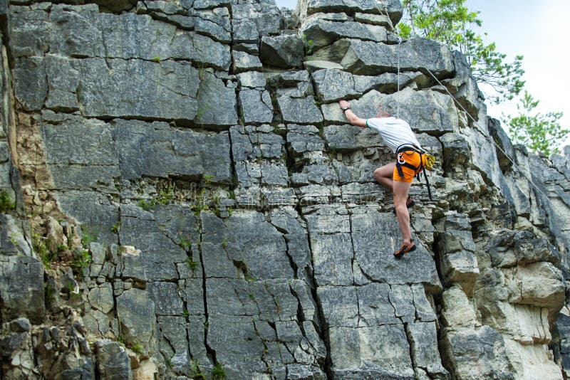 Climber Climbing on Top of a Mountain with a Safety Stock Photo Image of grip, lifestyle 46104512