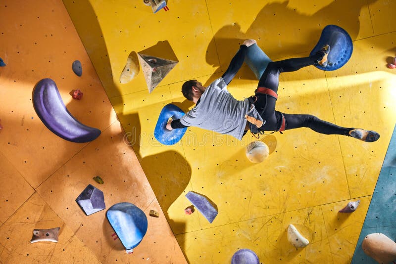 Climber without Forearm Training at Yellow Climbing Wall with