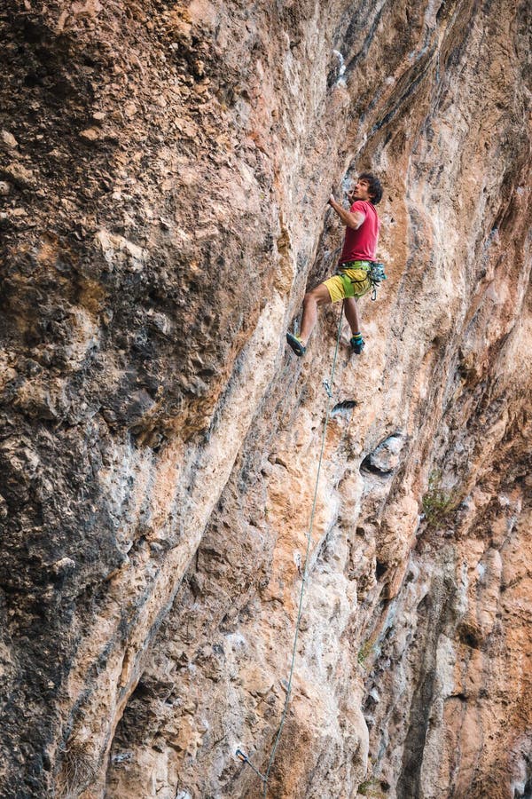 Climber a Difficult Climbing Route on a Natural Terrain Stock