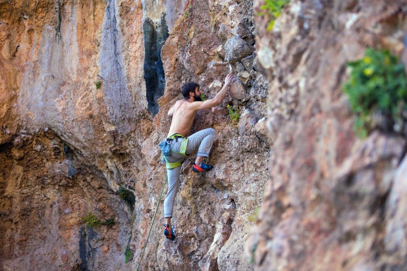 Climber a Difficult Climbing Route on a Natural Terrain Stock