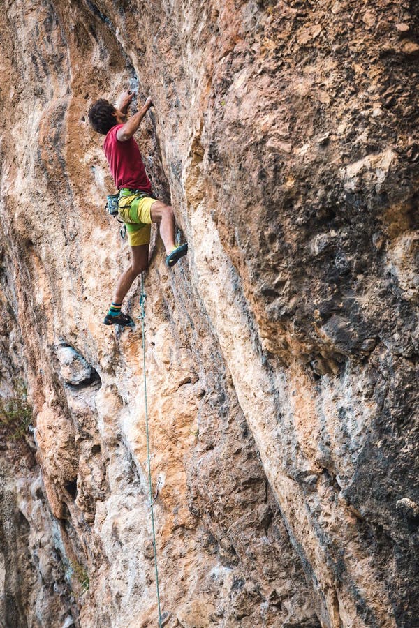 Climber a Difficult Climbing Route on a Natural Terrain Stock