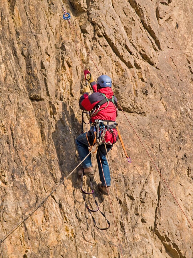 Climber swarming up the rock