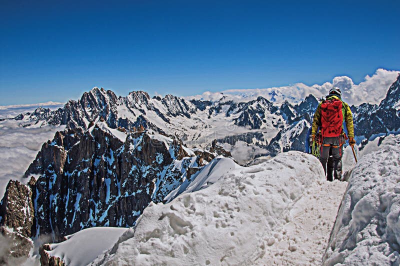 Climbers in french Alps Chamonix Mont Blanc, alpine mountains landscape, clear blue sky in warm sunny summer day. Retouched photo