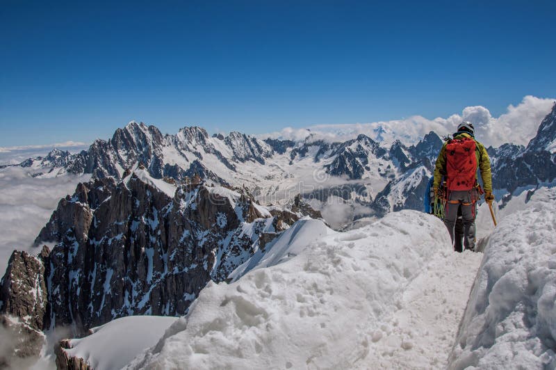 Climbers in french Alps Chamonix Mont Blanc, alpine mountains landscape, clear blue sky in warm sunny summer day. Retouched photo