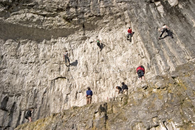 Climbers on Malham Cove Yorkshire Dales from the base of the cove. Climbers on Malham Cove Yorkshire Dales from the base of the cove