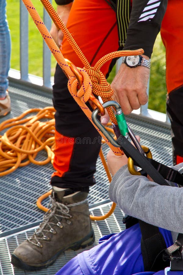 Climbing exersice on a tower. Female climbing high risk building stock images, royalty-free photos and pictures