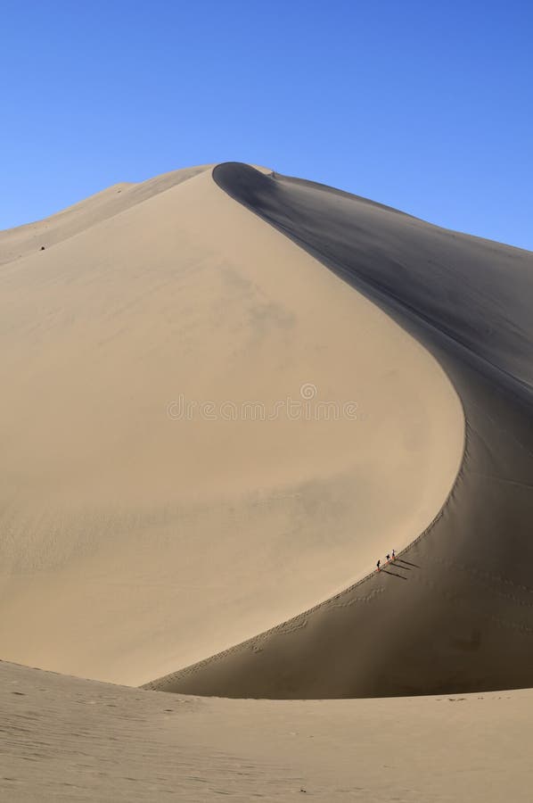 Climbing a sand dune. China stock photography