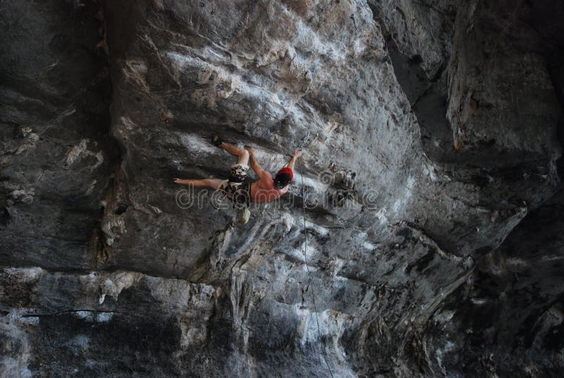 Climbing a steep rock face