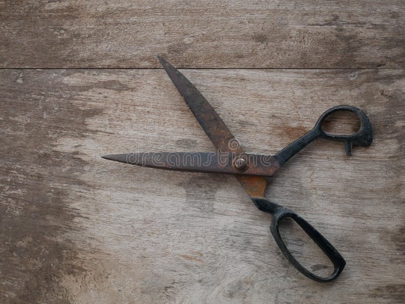 Old scissors on silk wood background royalty free stock images Old scissors on silk wood background royalty free stock images