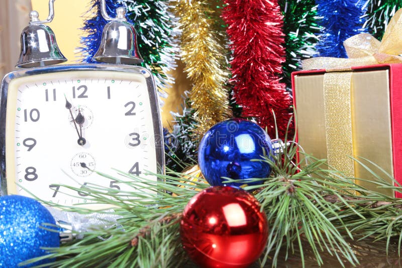 Clock and gift box on a christmas background