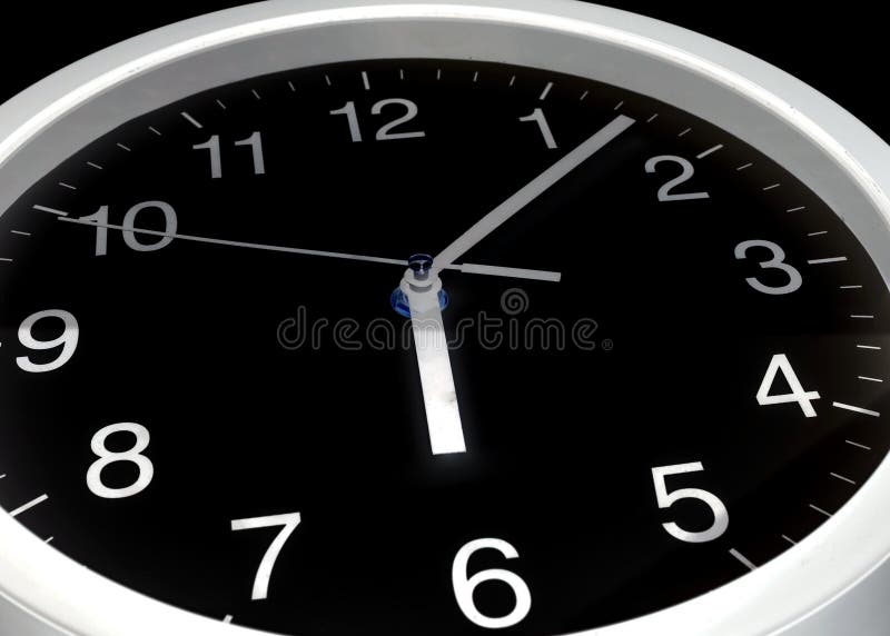 Clock or time abstract background, black clock and white needles, six o`clock, seven minutes