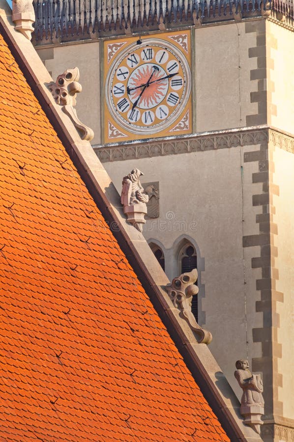 Clock on the tower of Church of St. Egidius  on Town hall square in Bardejov town during summer evening