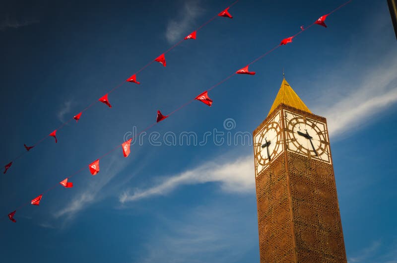 Clock tower in Tunis on the central square in downtown, Tunisia. Symbol of Tunis, blue sky is at the background