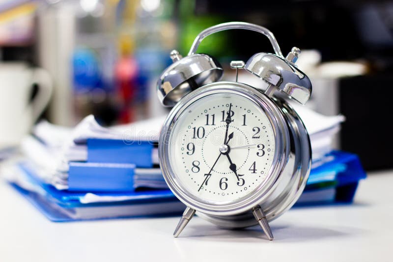 Clock on Work Desk with Docutment Background in the Office Time Stock Image Image of morning