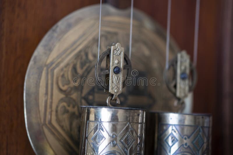 Clockwork of Old Clocks, Pendulum and Weights Closeup. Stock Image