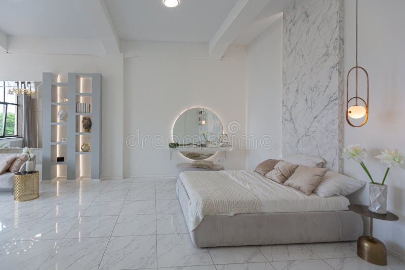 Close bedroom view with boudoir place in minimalistic light elegant luxury design of a modern spacious studio apartment in soft stock images