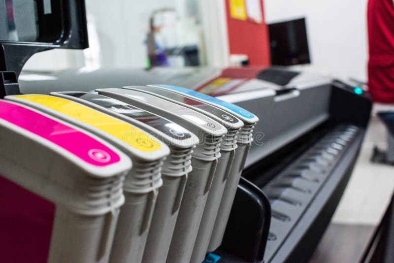 Close detail of ink cartridges in plotter for printing stock images