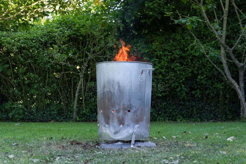 https://thumbs.dreamstime.com/b/close-home-made-metal-garden-incinerator-close-home-made-metal-garden-incinerator-seen-burning-general-household-non-185904487.jpg